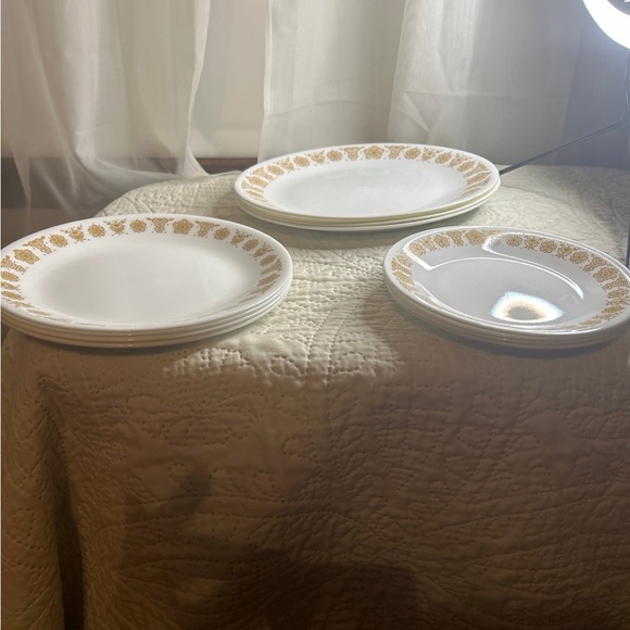4 settings, 3 different size Corningware By Corelle...